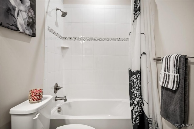 bathroom with toilet and shower / bath combo