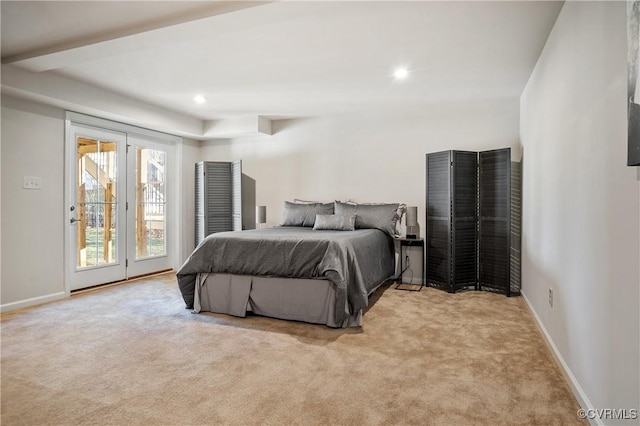 carpeted bedroom featuring access to outside