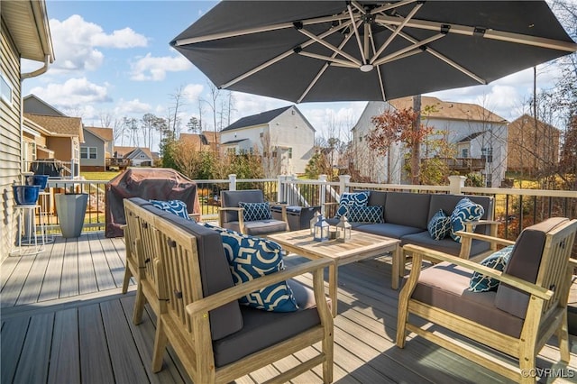 deck featuring an outdoor living space and area for grilling