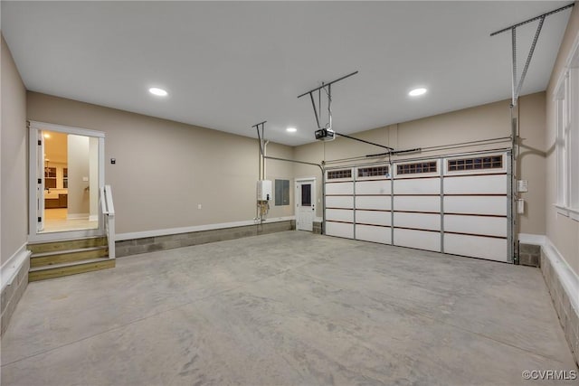 garage with a garage door opener and electric panel