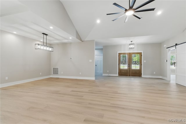 2280 Hensley Rd, Mineral, VA 23117 - unfurnished living room with a barn door, healthy amount of natural light, light wood-type flooring, recessed lighting, and lofted ceiling