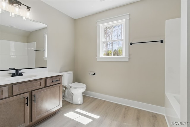2280 Hensley Rd, Mineral, VA 23117 - full bathroom featuring wood finished floors, vanity, toilet, baseboards, and shower / tub combination