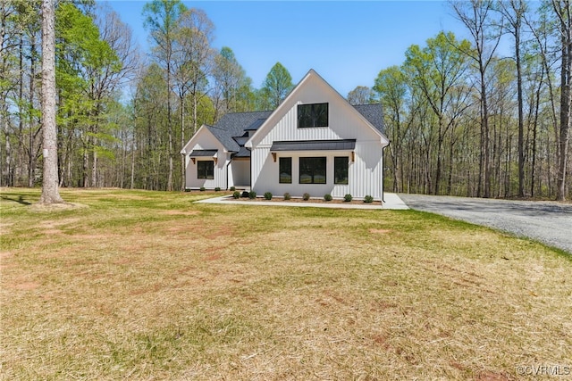 2280 Hensley Rd, Mineral, VA 23117 - modern inspired farmhouse with a front lawn, board and batten siding, and a shingled roof
