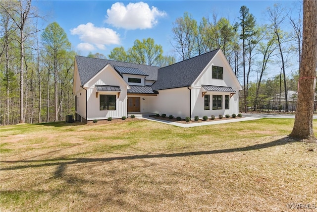 2280 Hensley Rd, Mineral, VA 23117 - modern farmhouse with a standing seam roof, metal roof, a front yard, and board and batten siding