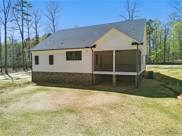 2280 Hensley Rd, Mineral, VA 23117 - rear view of house with a sunroom, central air condition unit, a shingled roof, a yard, and ceiling fan