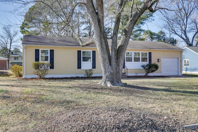 single story home featuring a garage and a front yard