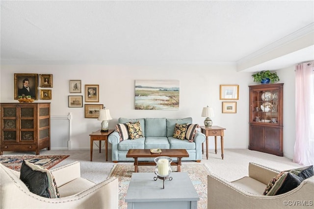 carpeted living room with ornamental molding