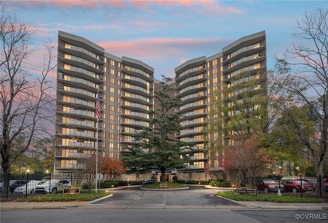 view of outdoor building at dusk