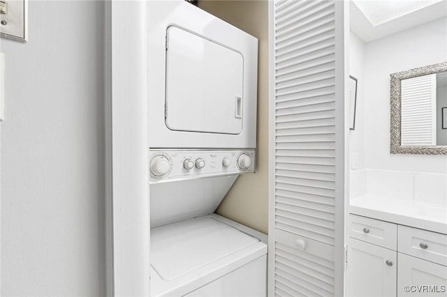 laundry room featuring stacked washer / dryer