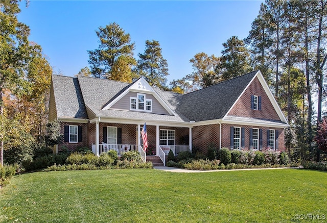 view of front of property with a front yard and covered porch