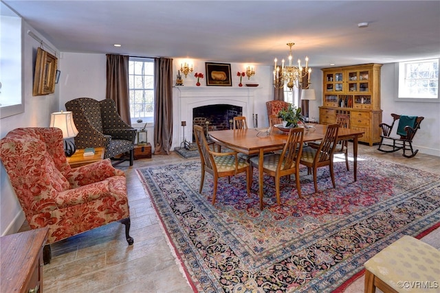 dining area featuring a notable chandelier and a healthy amount of sunlight