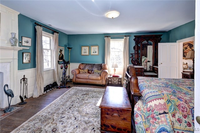 bedroom with dark hardwood / wood-style floors