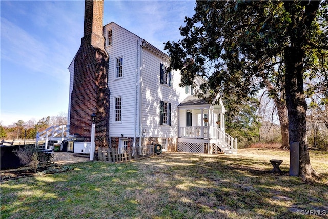 view of side of home featuring a yard