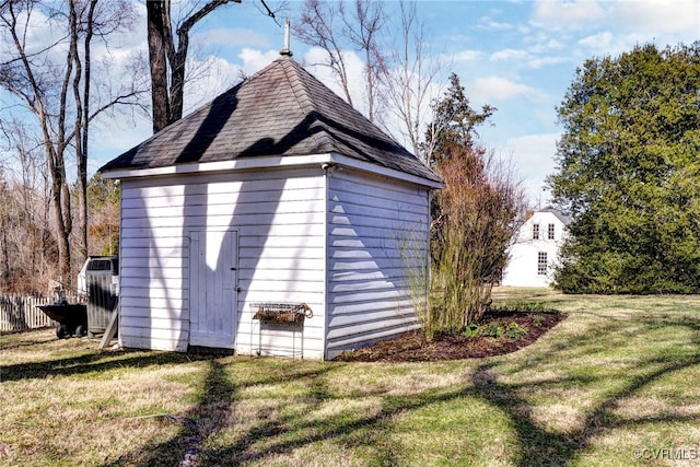 view of outbuilding with a lawn