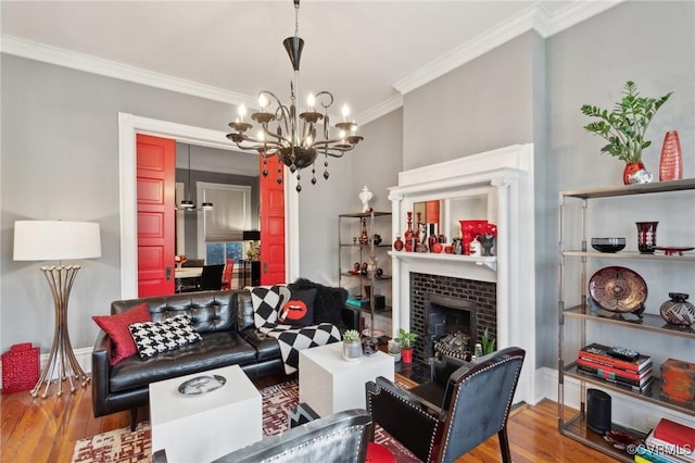 living room featuring hardwood / wood-style flooring, ornamental molding, and a fireplace