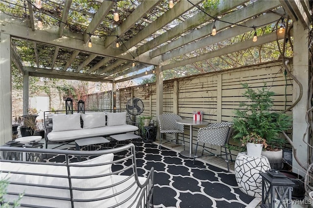 view of patio / terrace with outdoor lounge area and a pergola