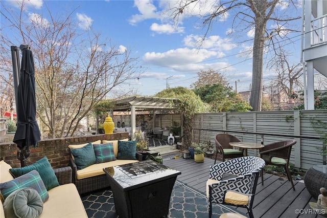 wooden deck with an outdoor living space and a pergola