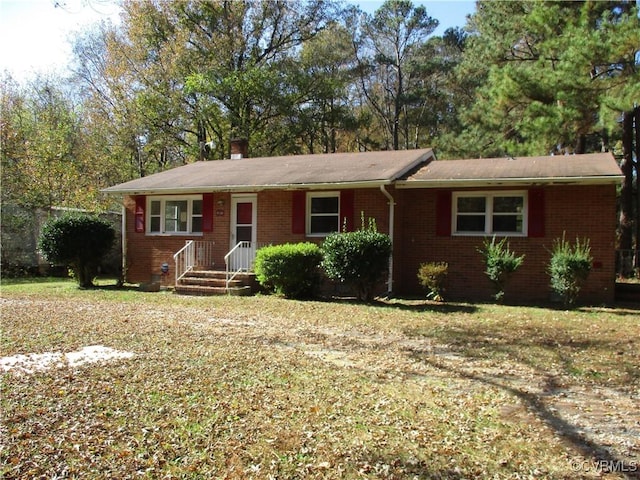 ranch-style house with a front lawn