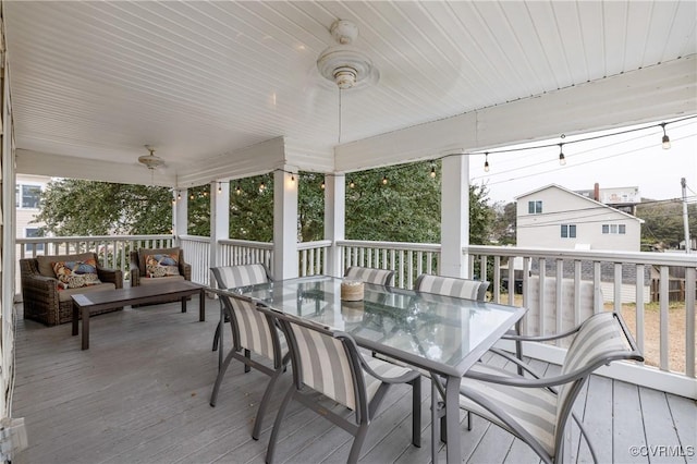 deck with an outdoor hangout area and ceiling fan