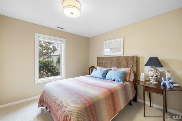 bedroom with light colored carpet