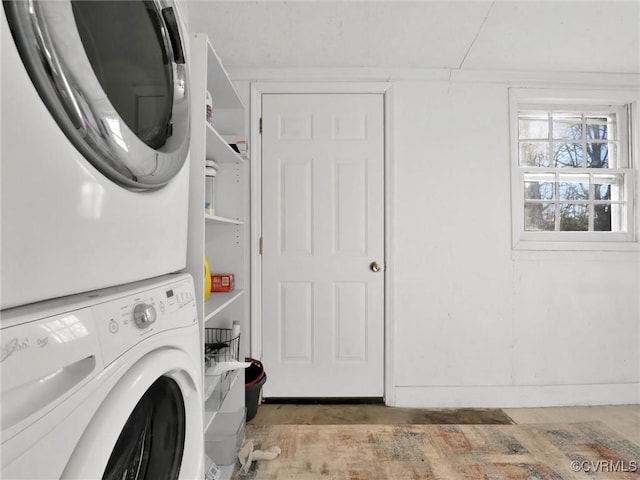 laundry area featuring stacked washer and dryer