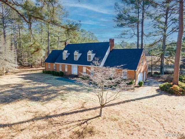 new england style home with a garage