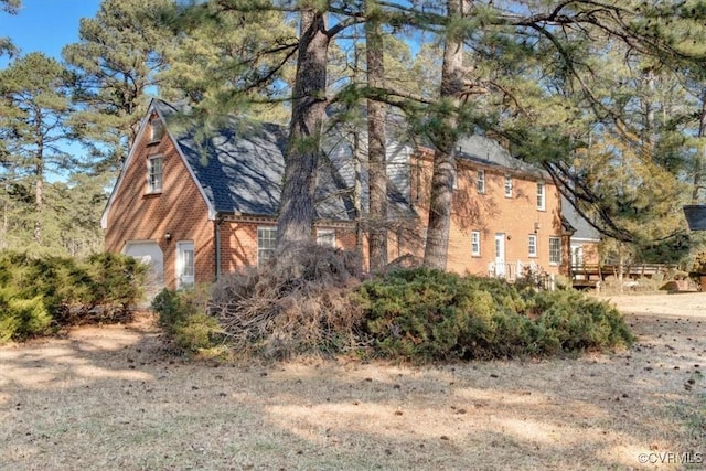 view of side of home with a garage