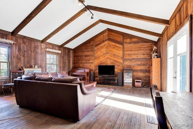 living room featuring high vaulted ceiling, hardwood / wood-style flooring, wooden walls, and beamed ceiling