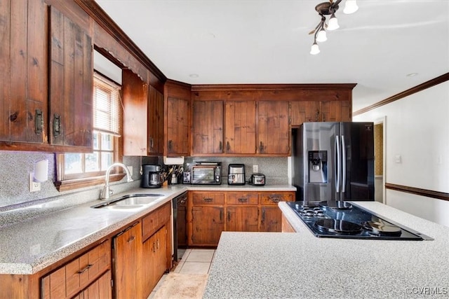 kitchen with black appliances, light tile patterned flooring, crown molding, backsplash, and sink