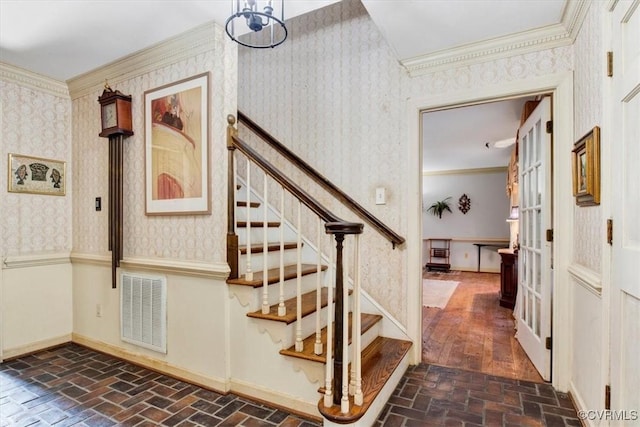 stairway with crown molding