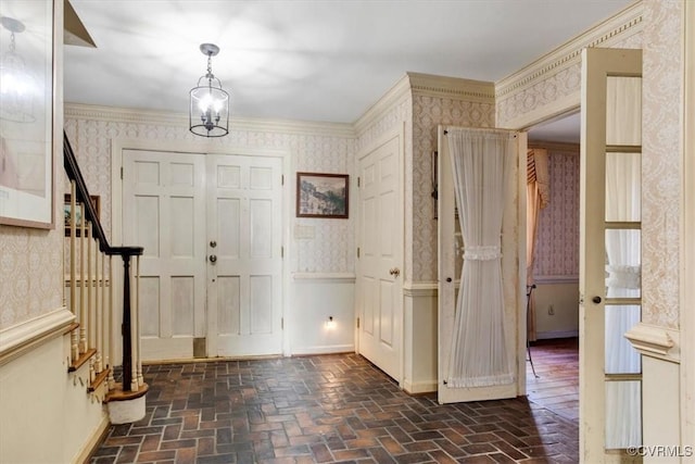 foyer featuring crown molding