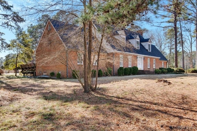 view of side of property with a yard