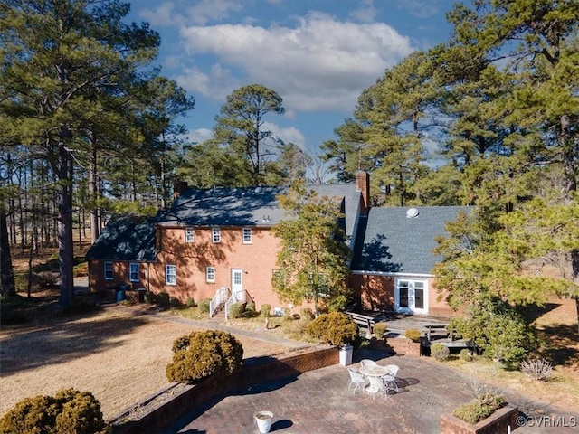 back of property with a patio area