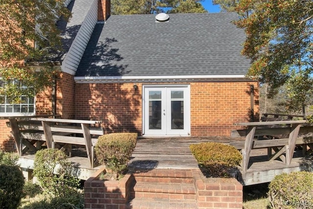 rear view of property with french doors and a deck