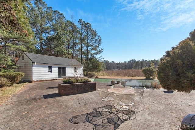 view of patio with an outdoor structure