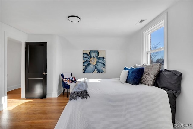 bedroom with light hardwood / wood-style floors