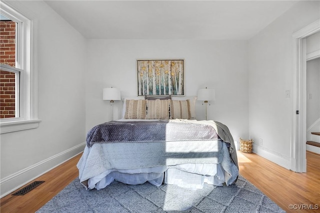 bedroom featuring hardwood / wood-style floors