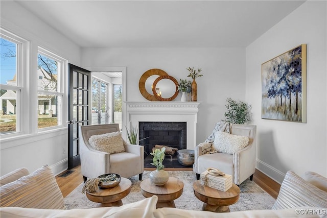 living area with light hardwood / wood-style flooring