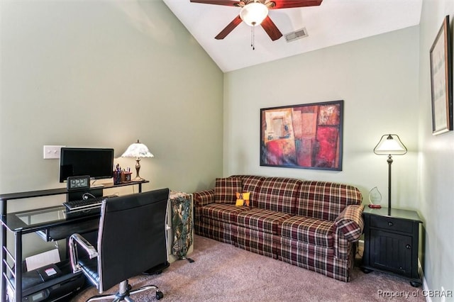 home office with lofted ceiling, ceiling fan, and carpet flooring