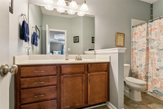 bathroom with vanity and toilet