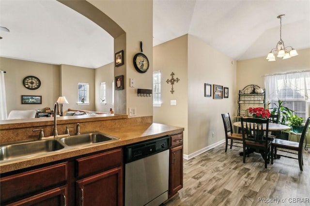 kitchen featuring sink, decorative light fixtures, a wealth of natural light, and dishwasher