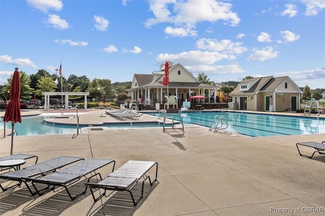 view of pool with a pergola and a patio area