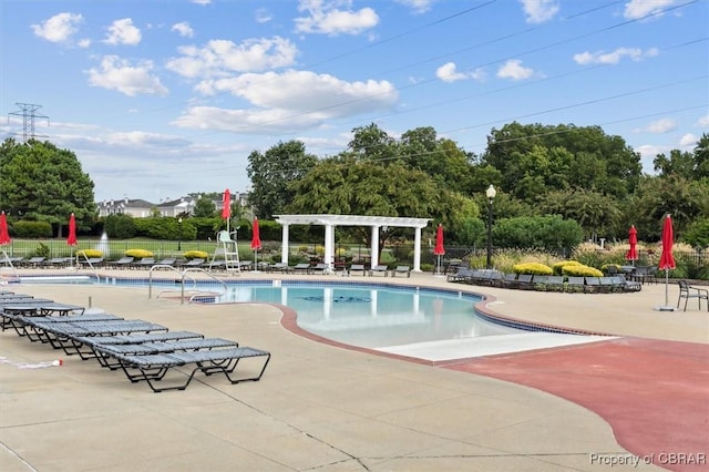 view of swimming pool featuring a pergola and a patio area