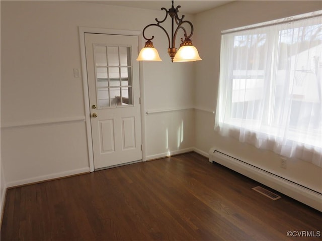 unfurnished dining area with a baseboard heating unit, a notable chandelier, and dark wood-type flooring