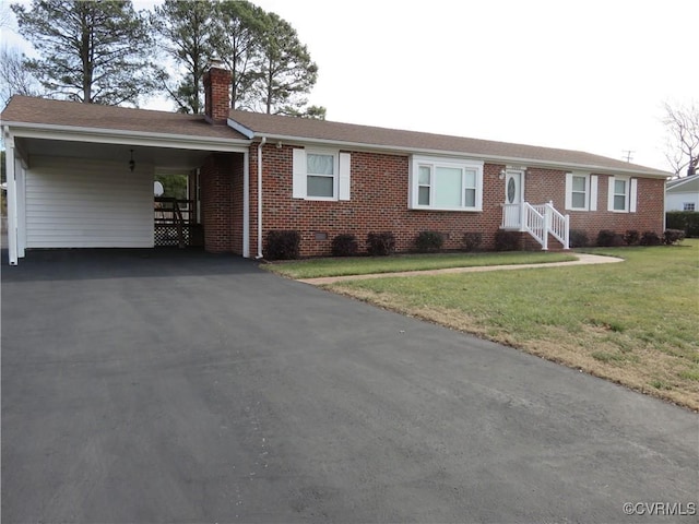 ranch-style house featuring a carport and a front yard