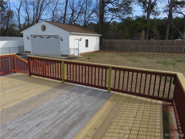 wooden deck featuring an outbuilding and a garage