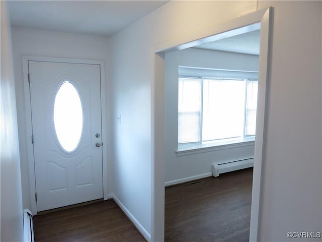 entryway featuring dark hardwood / wood-style flooring and a baseboard heating unit