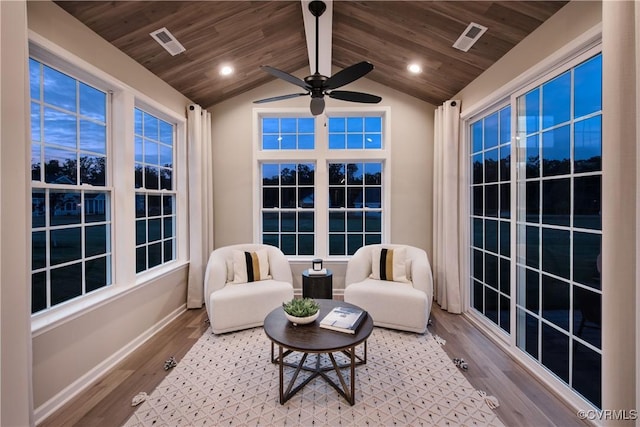 sunroom / solarium with ceiling fan, vaulted ceiling, and wooden ceiling