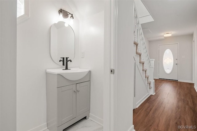 bathroom featuring vanity and baseboards