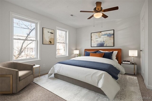 carpeted bedroom with ceiling fan